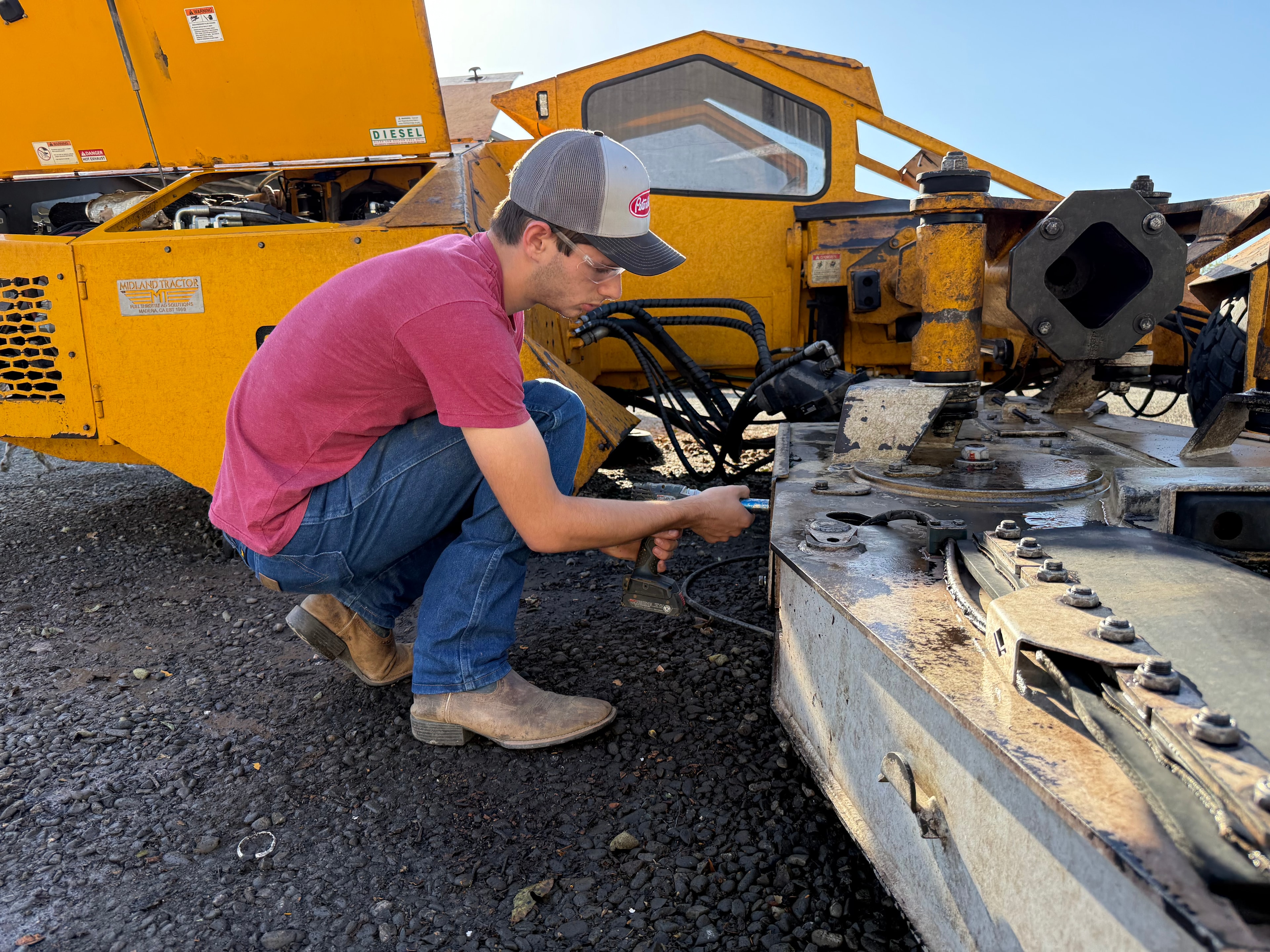 Daily maintenance on harvest equipment